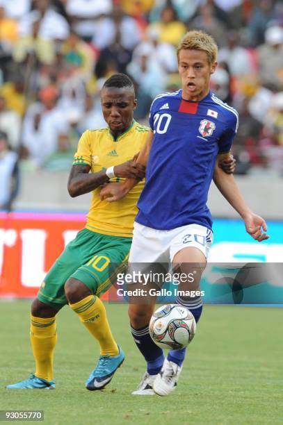 Teko Modise and Honda Keisuke in action durng the International match between South Africa and Japan at Nelson Mandela Bay Stadium on November 14,...