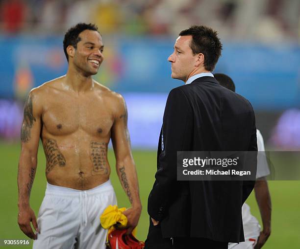 England players Joleon Lescott and John Terry look on after the International Friendly match between Brazil and England at the Khalifa Stadium on...