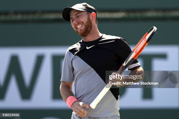 Dudi Sela of Israel reacts to a lost point while playing Kyle Edmund of Great Britai during the BNP Paribas Open at the Indian Wells Tennis Garden on...