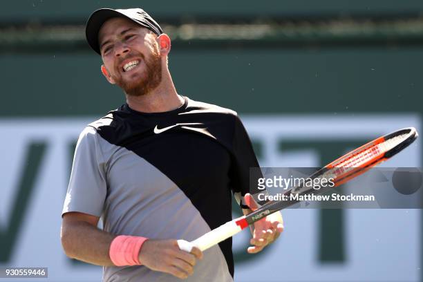 Dudi Sela of Israel reacts to a lost point while playing Kyle Edmund of Great Britai during the BNP Paribas Open at the Indian Wells Tennis Garden on...