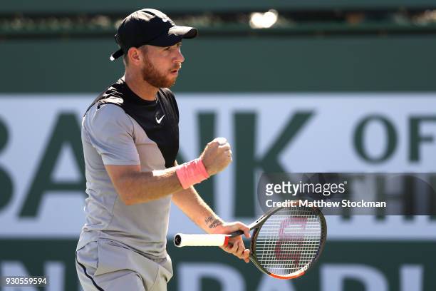 Dudi Sela of Israel celebrates breaking Kyle Edmund of Great Britai during the BNP Paribas Open at the Indian Wells Tennis Garden on March 11, 2018...
