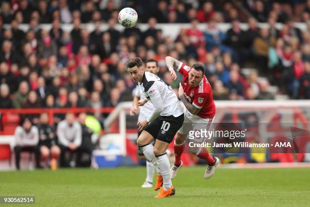 Tom Lawrence of Derby County fouls Lee Tomlin of Nottingham Forest during the Sky Bet Championship match between Nottingham Forest and Derby County...