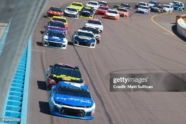 Kyle Larson, driver of the Credit One Bank Chevrolet, leads the field during the Monster Energy NASCAR Cup Series TicketGuardian 500 at ISM Raceway...