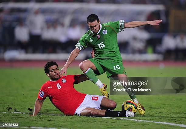 Karim Ky Ziani of Algeria skips through a challenge from Hany M Said of Egypt during the FIFA2010 World Cup qualifying match between Egypt and...