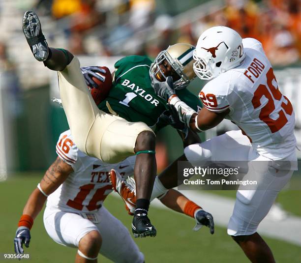 Inside receiver Kendall Wright for the Baylor Bears pull in a pass against defensive back Clark Ford for the Texas Longhorns in the second half on...