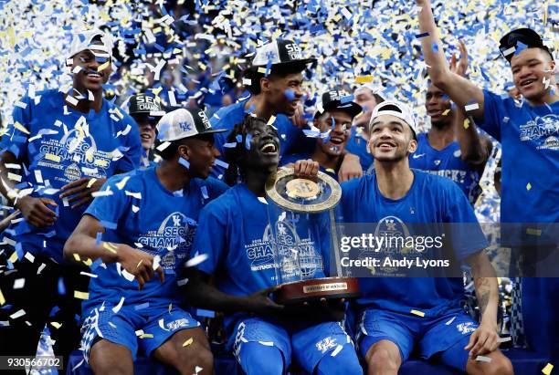 Wenyen Gabriel of the Kentucky Wildcats holds the winner's trophy after the 77-72 win over the Tennessee Volunteers in the Championship game of the...