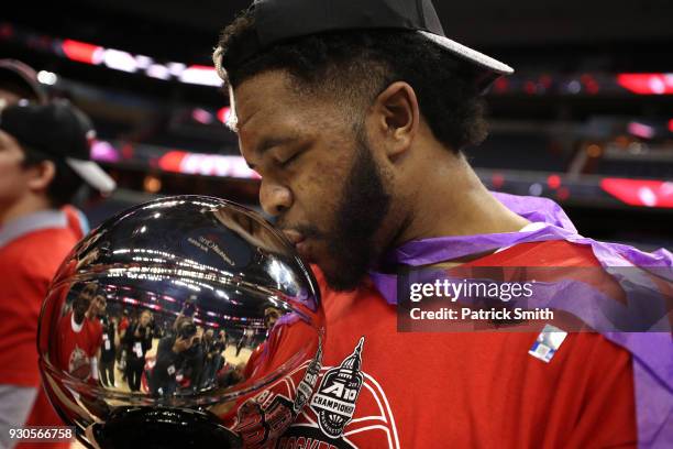 KiShawn Pritchett of the Davidson Wildcats celebrates after defeating the Rhode Island Rams in the Championship of the Atlantic 10 Basketball...