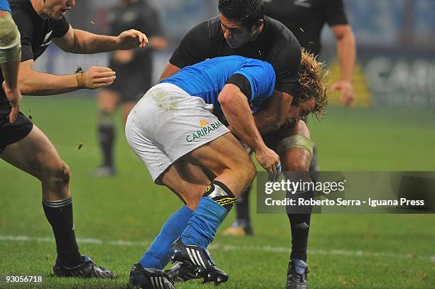 Mirco Bergamasco is tackled during the international match between Italy and New Zealand on November 14, 2009 in Milan, Italy.