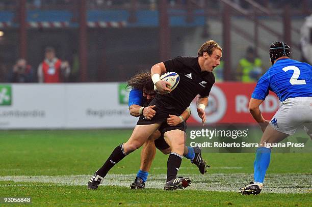 Martin Castrogiovanni tackles Luke McAlister during the Test Match between Italy and New Zealand at the San Siro Stadium on November 14, 2009 in...