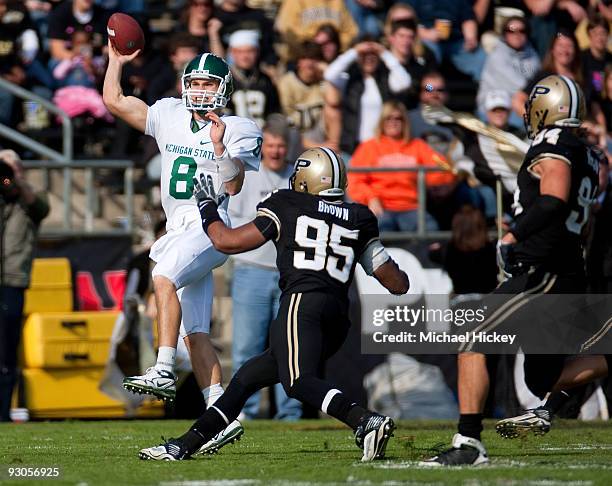 Kirk Cousins of the Michigan State Spartans gets a pass off during action against the Purdue Boilermakers at Ross-Ade Stadium on November 14, 2009 in...