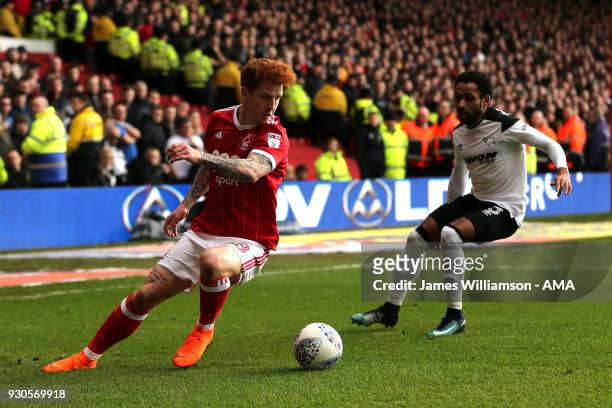 Jack Colback of Nottingham Forest and Ikechi Anya of Derby County during the Sky Bet Championship match between Nottingham Forest and Derby County at...