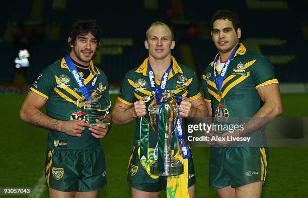 Johnathan Thurston , Darren Lockyer and Greg Inglis hold their trophies after victory over England in the Four Nations Grand Final at Elland Road on...