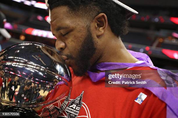 KiShawn Pritchett of the Davidson Wildcats celebrates after defeating the Rhode Island Rams in the Championship of the Atlantic 10 Basketball...