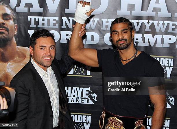 Promoter Oscar De La Hoya of Golden Boy Promotions and WBA heavyweight champion David Haye of England address the media at China Grill inside...