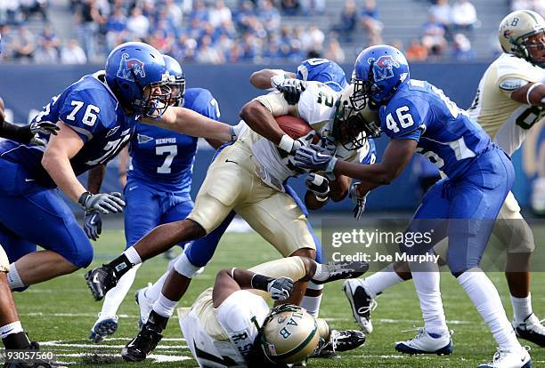 Nick Adams of the UAB Blazers is tackled by Bryan Wright and Charlie Bryant of the Memphis Tigers on November 14, 2009 at Liberty Bowl Memorial...
