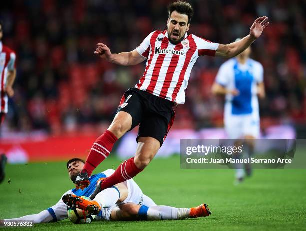 Benat Etxebarria of Athletic Club competes for the ball with Diego Rico of Club Deportivo Leganes during the La Liga match between Athletic Club...