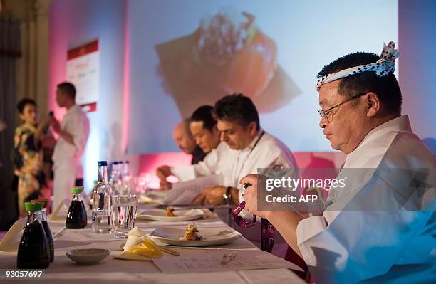 The six judges including global sushi ambassador Masayoshi Kazato taste the first entrant's dish at the "Seven Sushi Samurai" Sushi of the Year...