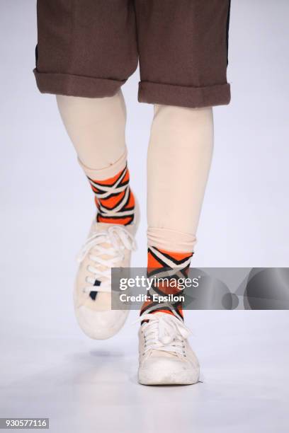 Models, shoe detail, walk the runway during the ARTEM SHUMOV fashion show at Mercedes Benz Fashion Week Russia Fall/Winter 2018/19 at Manege on March...