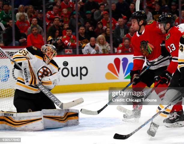 Boston Bruins goaltender Anton Khudobin stops a puck shot by Chicago Blackhawks right wing John Hayden during the first period on Sunday, March 11,...