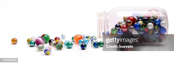 jar of marbles - glass sphere stock pictures, royalty-free photos & images