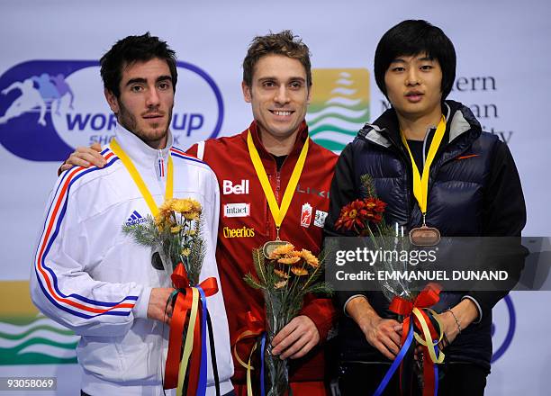 Canada's Francois-Louis Tremblay , with gold, France's Thibaut Fauconnet , with silver and South Korea's Sung Si-Bak, with bronze, celebrate on the...