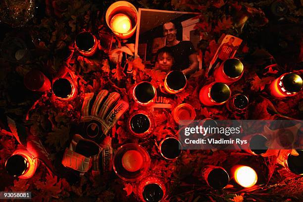 Fans gather to lay down candles and messages in memory of goalkeeper Robert Enke outside of the AWD Arena on November 14, 2009 in Hanover, Germany....