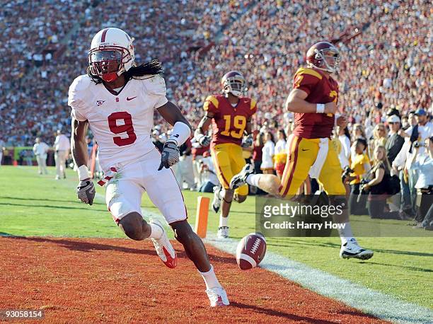Richard Sherman of the Stanford Cardinal scores a touchdown off an interception thrown by Matt Barkley of the USC Trojans during the second half at...