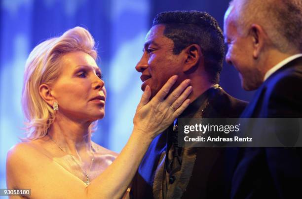 Host Ute Ohoven, singer Jermaine Jackson and UNESCO director for human rights Alexander Schischlik attend the Unesco Charity Gala 2009 at the Maritim...