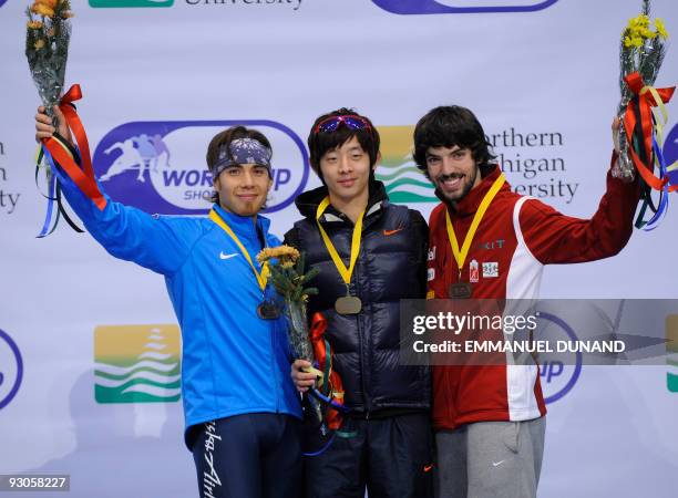 South Korea's Lee Jung-Su, with gold, US Apolo Anton Ohno , with silver and Canada's Charles Hamelin, with bronze, celebrate on the winners' podium...