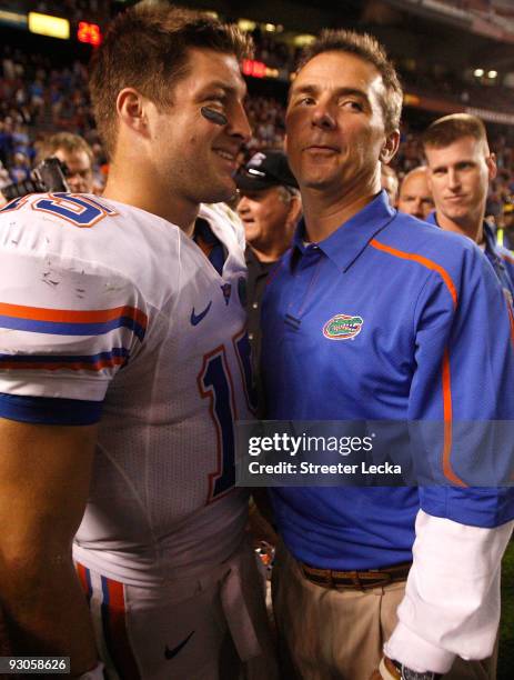 Head coach Urban Meyer and quarterback Tim Tebow of the Florida Gators celebrate after a 24-14 victory over the South Carolina Gamecocks during their...