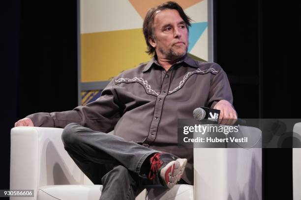 Richard Linklater speaks onstage at A Conversation with Olivier Assayas during SXSW at Austin Convention Center on March 11, 2018 in Austin, Texas.