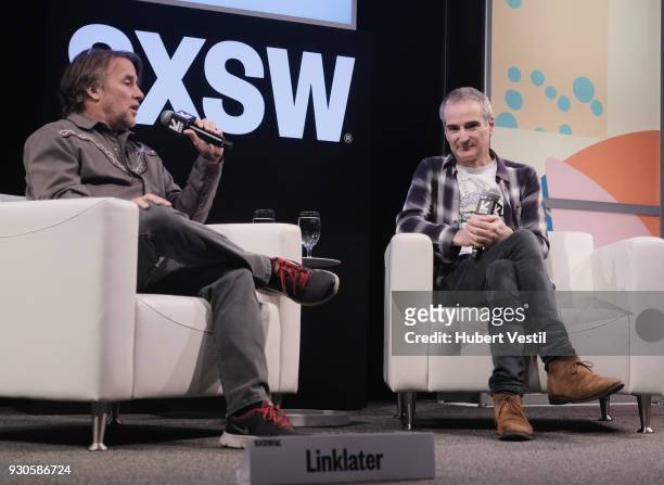 Richard Linklater and Olivier Assayas speak onstage at A Conversation with Olivier Assayas during SXSW at Austin Convention Center on March 11, 2018...