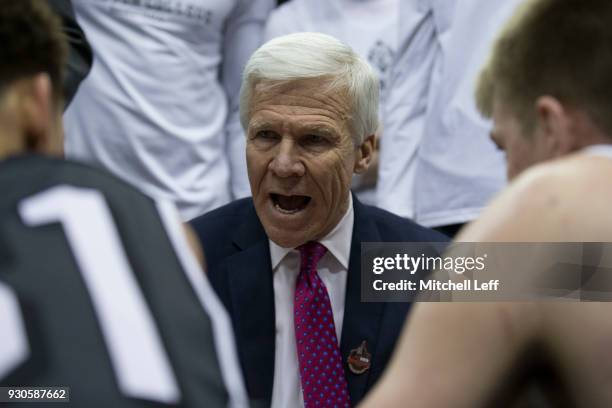Head coach Bob McKillop of the Davidson Wildcats talks to his team during a timeout against the Rhode Island Rams n the Championship game of the...
