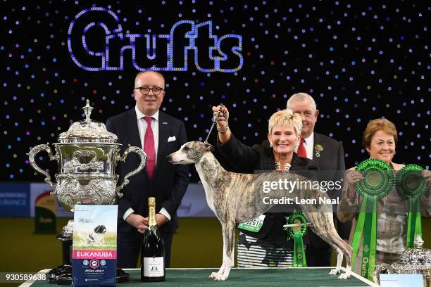 Owner Yvette Short smiles as Tease the Whippet wins Best In Show on day four of the Cruft's dog show at the NEC Arena on March 11, 2018 in...