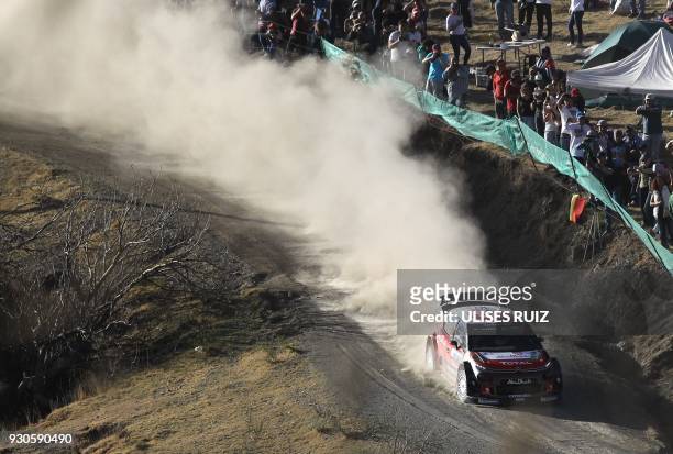 British Kris Meeke and co-driver Irish Paul Nagle steer their Citroen C3 during the final of the 2018 FIA World Rally Championship in Leon,...