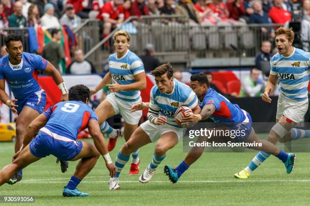 Tomas Passaro of Argentina avoids tackles from Samoa tacklers during Game- Argentina vs Samoa Pool B match at the Canada Sevens held March 10-11,...