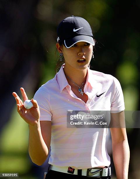 Michelle Wie of the United States reacts after her par putt on the fourth green during the third round of the Lorena Ochoa Invitational Presented by...