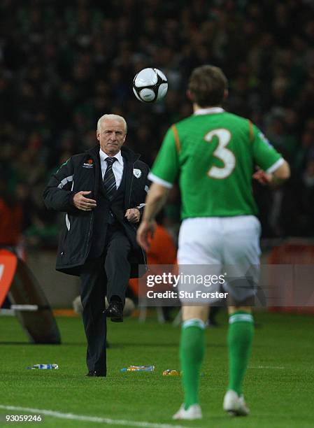 Republic of Ireland coach Giovanni Trapattoni kicks the ball to Kevin Kilbane during the FIFA 2010 World Cup Qualifier play off first leg between...