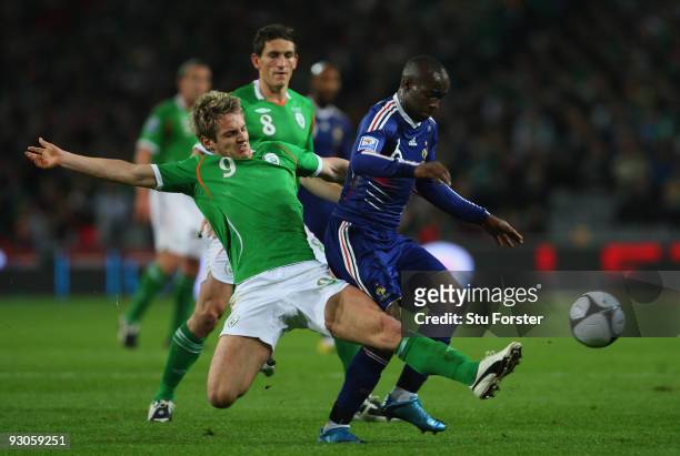 Ireland forward Kevin Doyle battles with Lassana Diarra during the FIFA 2010 World Cup Qualifier play off first leg between Republic of Ireland and...