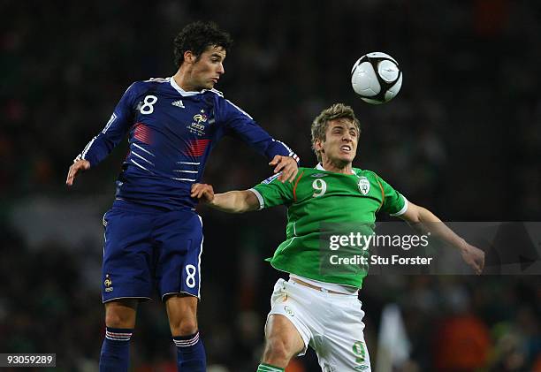 Ireland forward Kevin Doyle battles with Yoann Gourcuff during the FIFA 2010 World Cup Qualifier play off first leg between Republic of Ireland and...