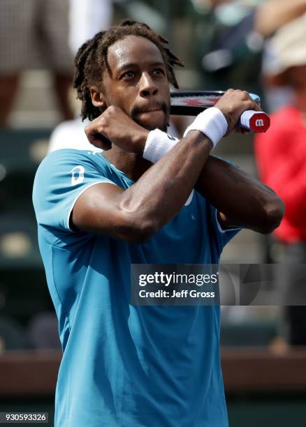 Gael Monfils of France does a black panther celebration following his victory over John Isner during the BNP Paribas Open on March 11, 2018 at the...