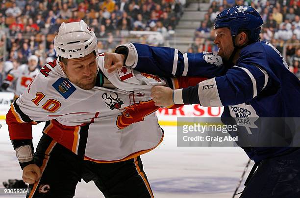 Brian McGrattan of the Calgary Flames fights with Colton Orr of the Toronto Maple Leafs during game action November 14, 2009 at the Air Canada Centre...