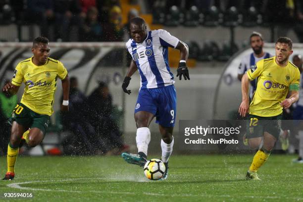 Porto's Cameroonian forward Vincent Aboubakar in action with Pacos Ferreira's midfielder Assis and Pacos Ferreira's Portuguese midfielder Pedrinho...