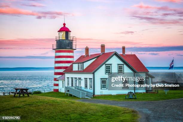 west quoddy lighthouse at sunset in lubec maine - west quoddy head lighthouse stock-fotos und bilder