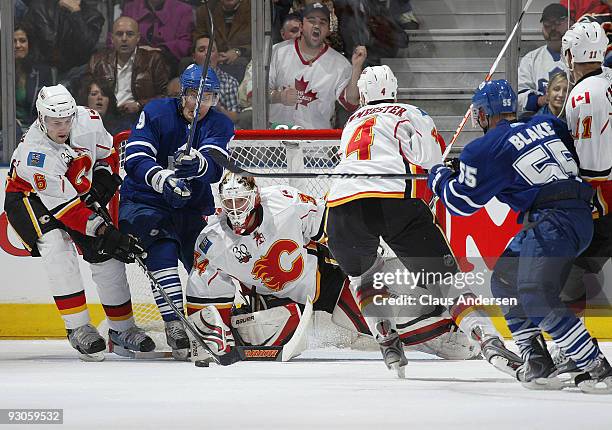 Miikka Kiprusoff of the Calgary Flames keeps his eye open for a rebound in a game against the Toronto Maple Leafs on November 14, 2009 at the Air...