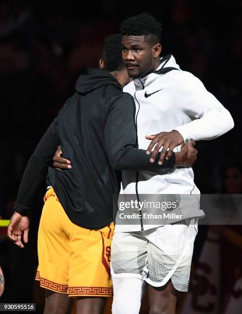 Chimezie Metu of the USC Trojans greets Deandre Ayton of the Arizona Wildcats on the court as the players are introduced before the championship game...