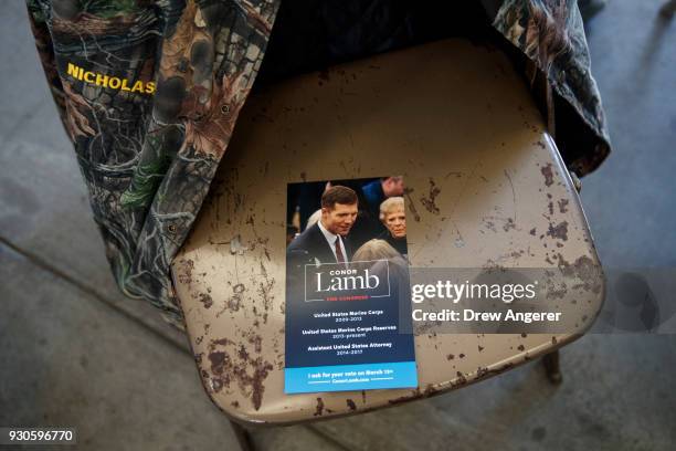 Campaign brochure sits on a seat before the start of a rally for Conor Lamb, Democratic Congressional candidate for Pennsylvania's 18th district, at...