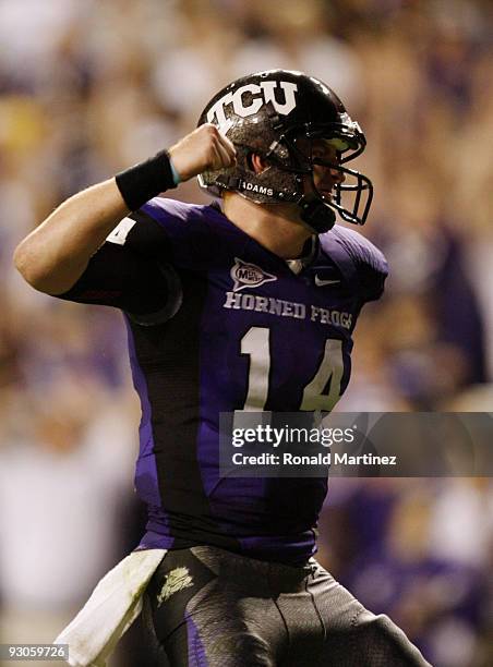 Quarterback Andy Dalton of the TCU Horned Frogs celebrates a touchdown scored by teammate Antoine Hicks in the second quarter against the Utah Utes...