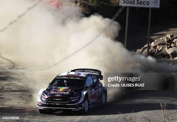 French Sebastian Ogier and co-driver Julien Ingrassia steer their Ford Fiesta WRC during the final day of the 2018 FIA World Rally Championship in...