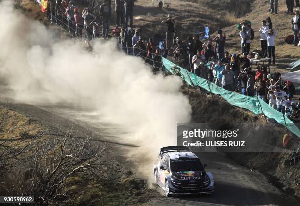 French Sebastian Ogier and co-driver Julien Ingrassia steer their Ford Fiesta WRC during the final day of the 2018 FIA World Rally Championship in...